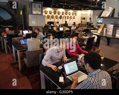 Chinese entrepreneurs in a co-working space, in zhongguancun, technological hub of Beijing Stock Photo