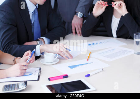 Working business people analyzing financial reports in office Stock Photo