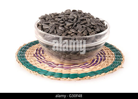 sunflower seeds in the bowl on a stand isolated on white Stock Photo