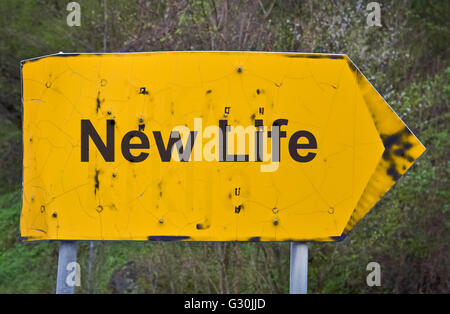 Text New Life written on a yellow road sign Stock Photo