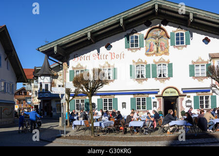 Hotel ' Alte Post ' with Lüftlmalerei and cyclists, Germany, Bayern, Bavaria, Oberbayern, Upper Bavaria, Oberammergau Stock Photo