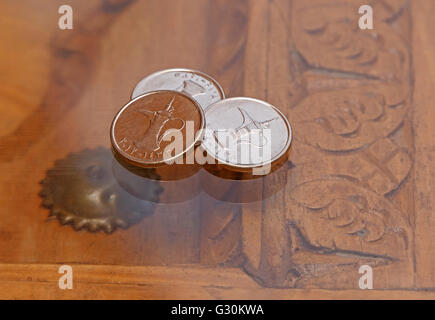 three dirham coins on table Stock Photo