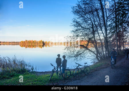 lake Staffelsee at sunset with children with bicycle, Germany, Bayern, Bavaria, Oberbayern, Upper Bavaria, Murnau am Staffelsee Stock Photo