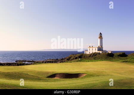 New and redesigned ninth putting green also known as Bruces Well on Ailsa course, at the famous lighthouse at Trump Turnberry Stock Photo