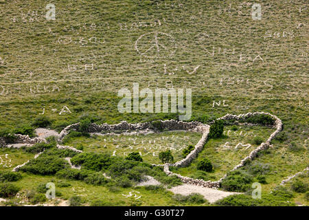 Giant rock letters on meadow made by tourists Stock Photo