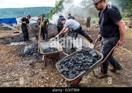 Running, burning,  of a  traditional charcoal kiln in Winterberg-Züschen, Sauerland, Germany, historical way of making charcoal, Stock Photo