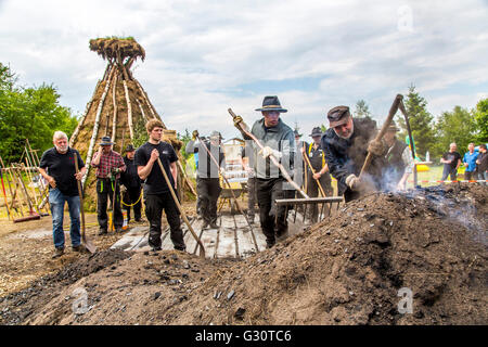 Running, burning,  of a  traditional charcoal kiln in Winterberg-Züschen, Sauerland, Germany, historical way of making charcoal, Stock Photo