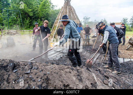 Running, burning,  of a  traditional charcoal kiln in Winterberg-Züschen, Sauerland, Germany, historical way of making charcoal, Stock Photo