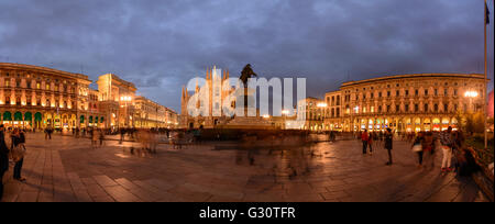 Piazza del Duomo with triumphal arch at the entrance to the Galleria Vittorio Emanuele II , Cathedral , equestrian statue of Vit Stock Photo