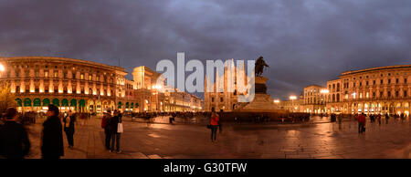 Piazza del Duomo with triumphal arch at the entrance to the Galleria Vittorio Emanuele II , Cathedral , equestrian statue of Vit Stock Photo