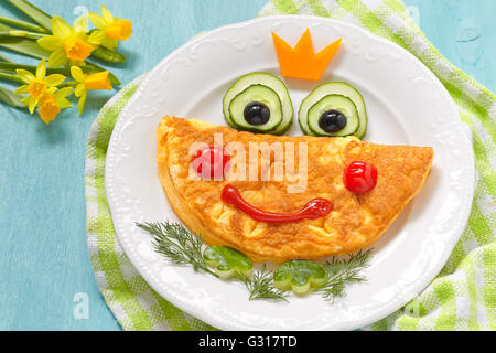 Funny smiling frog princess omelette Stock Photo