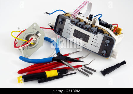 VILNIUS, LITHUANIA - MAY 11, 2016: Repair of spar parts and printed circuit boards from modern household appliances of the Phili Stock Photo