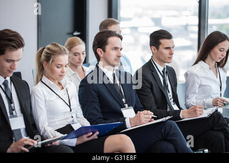Business group of people making notes during a meeting conference Stock Photo