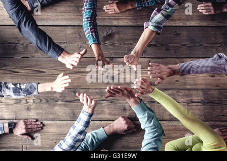 Hipster business successful teamwork concept, cheerful business group giving high five Stock Photo
