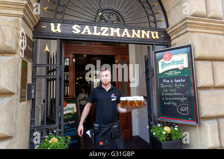 Waiter serving Pilsener beer in Pilsen Famous restaurant U Salzmannu, Pilsen Czech Republic Stock Photo