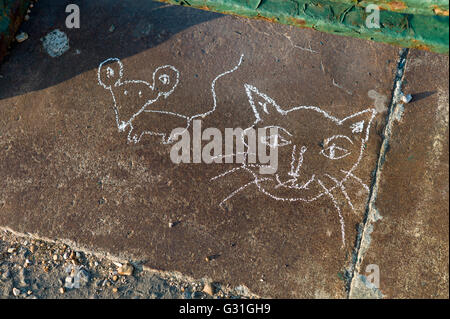 Child's chalk drawing on pavement, cat and mouse Stock Photo