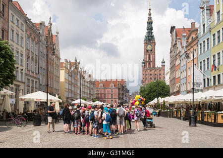 The Town Hall, colourful building facades and tourists on Dluga street, Gdansk, Poland Stock Photo