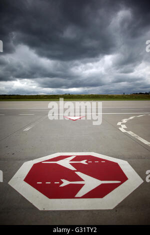 Lautzenhausen, Germany. 11th July, 2012. A sign placed on the runway of the airport Frankfurt-Hahn warns pilots and passengers of crossing airplanes in Lautzenhausen, Germany, 11 July 2012. Photo: Fredrik von Erichsen | usage worldwide/dpa/Alamy Live News Stock Photo