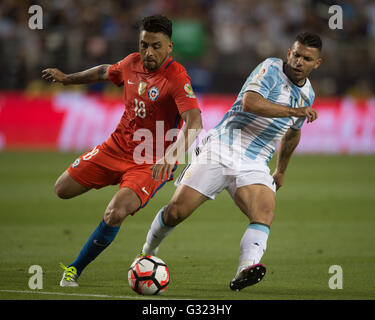 Santa Clara, USA. 6th June, 2016. Argentina's Sergio Aguero (R) vies with Chile's Gonzalo Jara during their Copa America Centenario Group D match at the Levi's Stadium in Santa Clara, California, the United States, June 6, 2016. Argentina won by 2-1. Credit:  Yang Lei/Xinhua/Alamy Live News Stock Photo