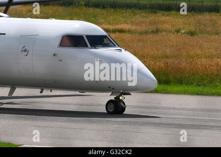 Commuter airline airplane on rolling take off on a runway Stock Photo