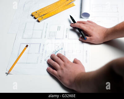 Business man draw buildings and present his architectural project Stock Photo