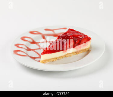 Cheesecake with strawberry jelly. Close up side view. Stock Photo