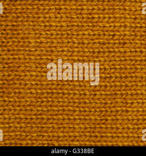 Dark goldenrod wool knitted fabric texture. Close up fragment of the top view. Stock Photo