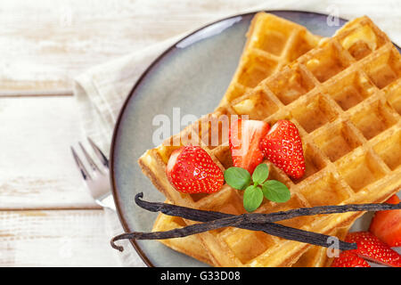 Belgian Waffles with Fresh Strawberries and Vanilla beans Stock Photo