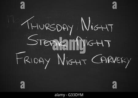 Blackboard for food nights outside a pub. Stock Photo