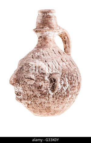 an ancient terracotta vase or jug shaped like a human face isolated over a white background Stock Photo