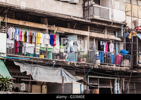Wooden slums on stilts on the riverside of Chao Praya River in Bangkok, Thailand Stock Photo