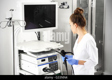 Doctor gastroenterologist with probe to perform gastroscopy and colonoscopy Stock Photo