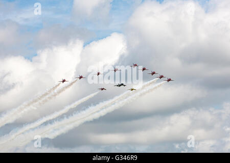 Royal Air Force Red Arrows display team in formation with a Hawker Hunter and two Folland Gnats at the RAF Waddington Airshow Stock Photo