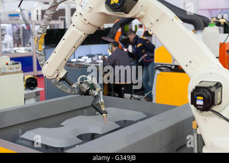 Welding robot arm Stock Photo