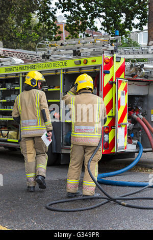 Dorset & Wiltshire Fire and Rescue firemen at scene of fire at Stock ...