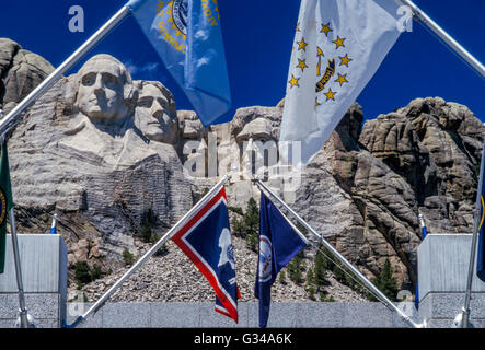 Mount Rushmore National Memorial - Black Hills in Keystone, South Dakota, United States with flags in the foreground. Stock Photo