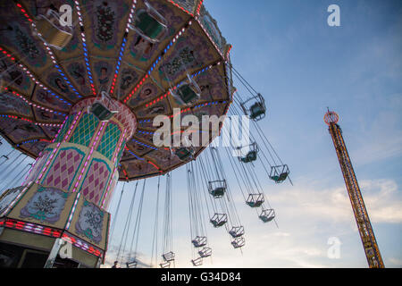 Chain swing, main attraction on the midway in the amusement park, entertainment at the local fair for all to enjoy Stock Photo