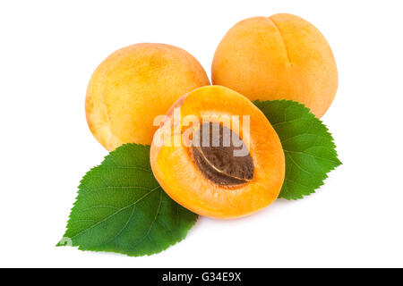 Fresh apricots with leaves isolated on white. Stock Photo