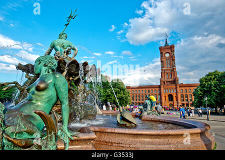 Red Town Hall and Neptune Fountain in Berlin Stock Photo