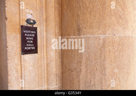 'Visitors please ring for hall porter' sign by door bell button, Camberley, Hampshire, England, United Kingdom, Europe Stock Photo
