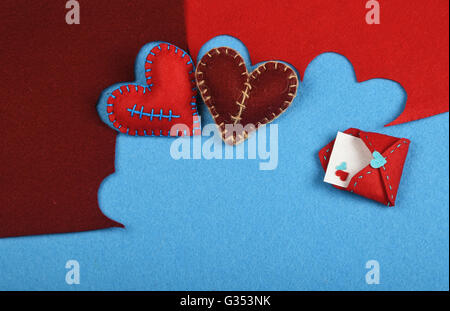 https://l450v.alamy.com/450v/g353nk/felt-craft-and-art-two-handmade-stitched-toy-hearts-brown-and-red-g353nk.jpg