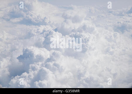 Beautiful, puffy clouds as seen from above. Cumulus clouds over the Atlantic Ocean. Stock Photo