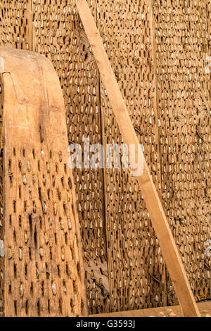 Vintage thresher made of wood and flint stone. Stock Photo