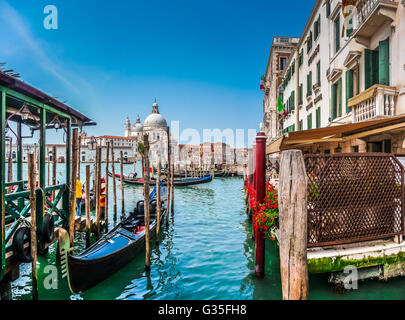 Beautiful view of traditional Gondola on Canal Grande with historic Basilica di Santa Maria della Salute, Venice, Italy Stock Photo