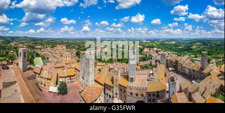 Aerial wide-angle view of the historic town of San Gimignano with tuscan countryside on a sunny day, Tuscany, Italy Stock Photo