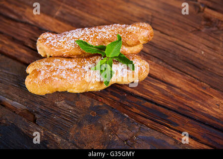 Two eclair decorated with mint Stock Photo