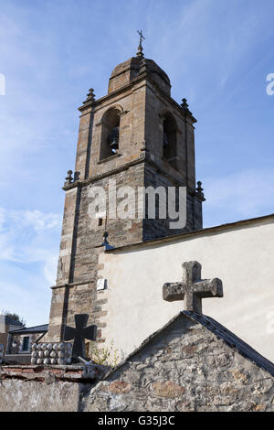 Triacastela, Spain: Bell tower of the Iglesia de Santiago from the cemetery. Stock Photo