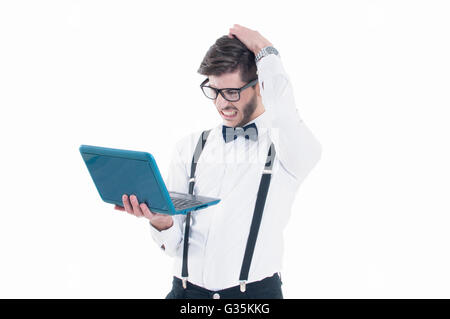 Young business man looking at his laptop with disappointment. Isolated on white background Stock Photo
