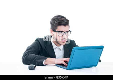 Young business man looking at his laptop with disappointment. Isolated on white background Stock Photo