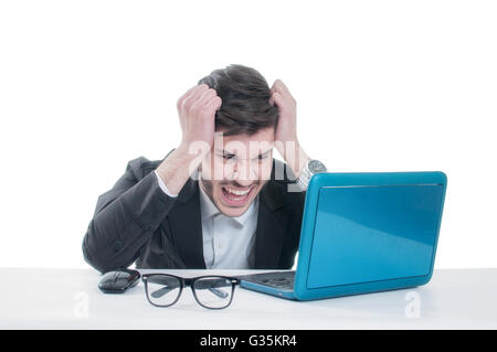 Angry young businessman with problems and stress at his workplace. Isolated on white background Stock Photo